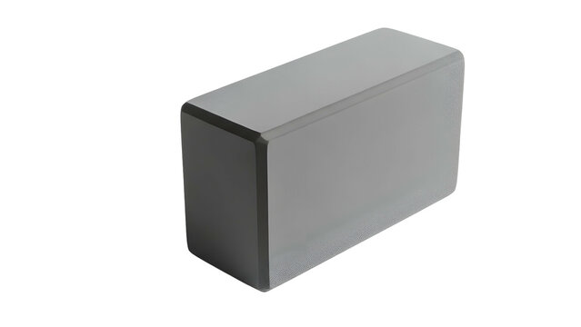 A three-dimensional, rectangular, gray object with rounded edges, resting against black - Powered by Adobe