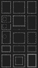 Fototapeta premium A collection of ornate frames in various shapes and sizes, outlined in white against a dark background. The frames include squares, rectangles, and circles