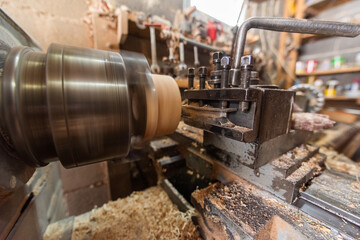 Woodworking Lathe Shaping Wood With Metal Tools In Workshop Carpentry Equipment For Wood Turning And Woodworking.