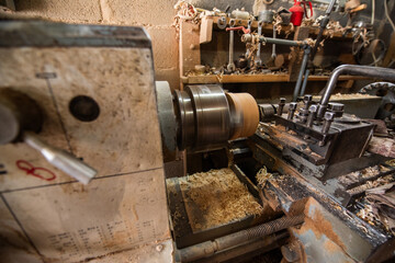 Woodworking Lathe Shaping Wood With Metal Tools In Workshop Carpentry Equipment For Wood Turning And Woodworking.