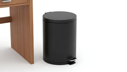 Angled shot of a cylindrical black step trash can beside a light wood desk leg on white