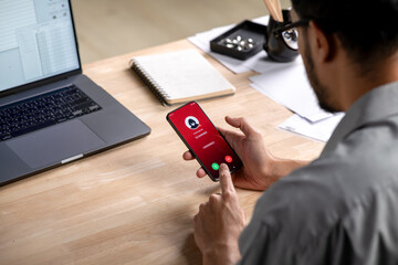 Receiving call from unknown person or Scammer, Hands holding phone with incoming call from scammer