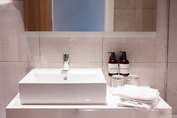 Modern minimalist bathroom with mirror, faucet, basin, and stylish interior clean design.