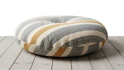 Round, striped floor cushion with button detail rests on a weathered, white wooden surface