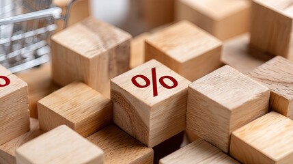 Obraz premium A small shopping cart holds wooden blocks, each displaying letters and words, on a clean table in a cozy indoor space