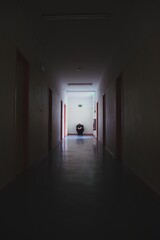 Lonely guy in dark corridor