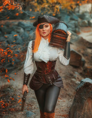Art photo real person beauty woman one-eyed pirate holds in hands carries old style brown chest walking at island, armed with pistol gun. dark wooden box. Girl thief. game search for pirates treasure