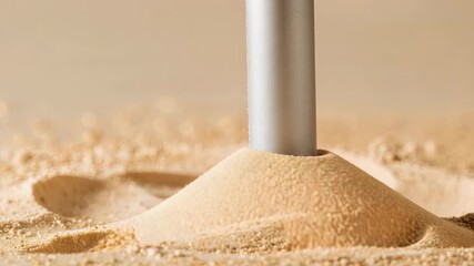 A detailed demonstration of sand application using a sprayer reveals the precision and technique involved in surface treatment