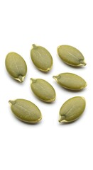 Green pumpkin seeds on white background close up studio shot