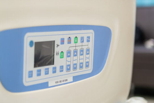 Detailed look at hospital room medical equipment control panel in clinical setting