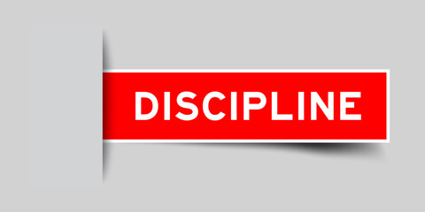 Red color square shape sticker label with word discipline inserted in gray background