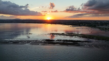 Insanely beautiful drone photography of a scenic sunrise, early in the morning, by the salt marshes in Marsala, Sicily, during a lovely morning.	