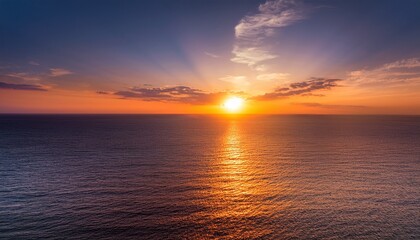 Obraz premium The Breathtaking Vista Showcases A Tranquil Seascape Where The Sun S Golden Rays Paint The Sky Illuminating The Horizon With A Warm Inviting Glow During The Evening