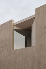 This striking architectural piece features a minimalist concrete design that highlights modern concepts in construction, offering a unique visual appeal and innovative use of materials.