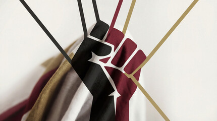 A powerful fist grips colorful ribbons, embodying themes of strength, unity, and resilience, making a bold statement about social change and artistic expression in modern art.