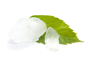 Two pieces of alum on white background