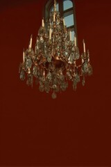 Large ornate chandelier glowing in warm tones