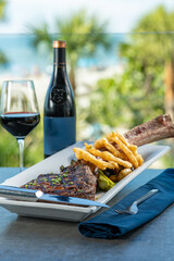 Tomahawk ribeye steak with truffle fries.
