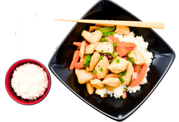 asian stir-fry chicken with vegetables and rice isolated on white