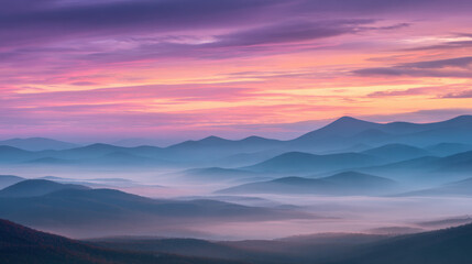 Mountains and layered clouds at sunrise with colorful sky