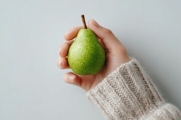 Green Pear in Hand – Natural Food, Minimalist Composition