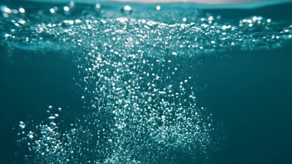 Underwater Symphony A Captivating Display of Ascending Bubbles in Deep Blue Water Creating a Mesmerizing and Ethereal Visual Experience Perfect for Nature Documentaries and AquaticThemed Projects.