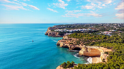 Aerial from the famous cave of Benagil and the little town Benagil on the southcoast in the Algarve Portugal