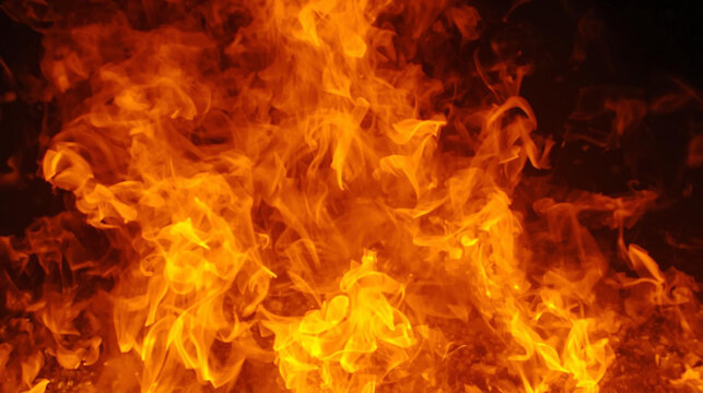 Dynamic abstract fiery background with orange and yellow flames against black, perfect for warmth, heat, energy, or danger concepts. Fire texture for design. - Powered by Adobe