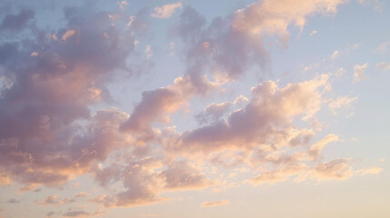 Beautiful pastel sky with fluffy clouds at sunset. Soft hues of pink, orange, and blue create a serene natural background, perfect for calm and dreamy concepts.