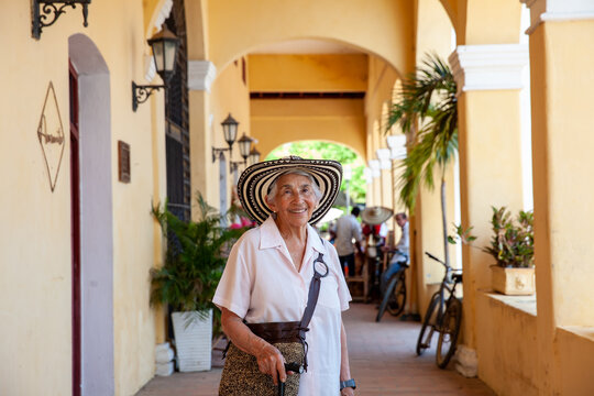 Senior travel. Senior woman at the beautiful heritage town of Mompox wearing the traditional Sombrero vueltiao.