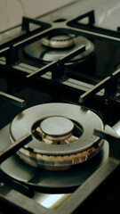 Close up of a gas stove. A detailed close-up view of a modern stainless steel gas stove burner.