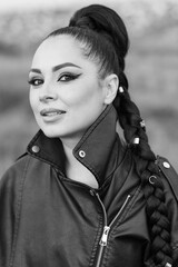 girl with artistic makeup in leather shorts