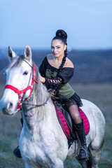 Charming European lady posing with a majestic white horse in an open field, symbolizing freedom, calmness, and connection with nature.