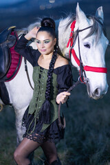 Charming European lady posing with a majestic white horse in an open field, symbolizing freedom, calmness, and connection with nature.