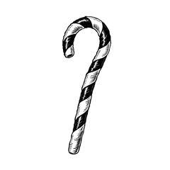 Striped candy cane with curved top in classic festive shape Concept of Christmas sweets and holiday decoration - treat - tradition