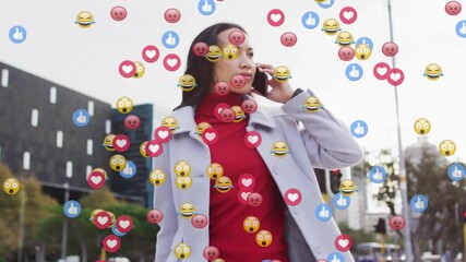 Woman commuting crossing pulling suitcase answering phone causing social media emojis filling face - Powered by Adobe