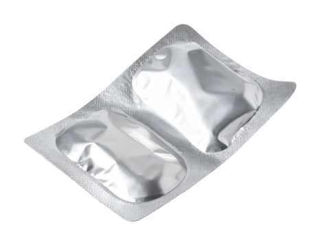 Silver blister pack with two medical tablets and foil packaging on isolated background