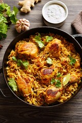 Homemade delicious chicken biriyani served in cast iron pan
