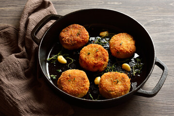Cod fish potato cakes in cast iron skillet