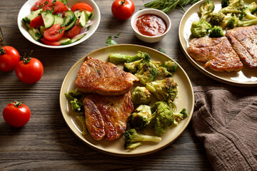 Grilled pork steak served with roasted broccoli
