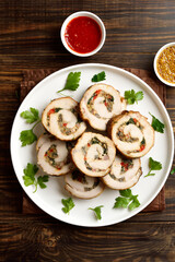 Sliced diet pork roll stuffed with mushroooms, red bell pepper, spinach