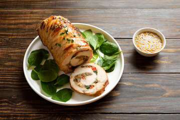 Roasted pork roll stuffed with mushroooms, onion, red bell pepper, spinach