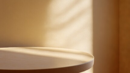 A round table sits quietly in a softly lit room, surrounded by a warm beige wall that enhances the calm atmosphere of the space