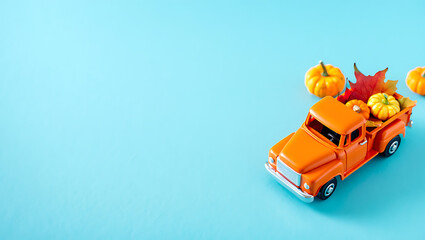 A whimsical autumn illustration of a vintage orange truck carrying pumpkins and fall leaves.