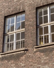 facade of an older brick building with windows