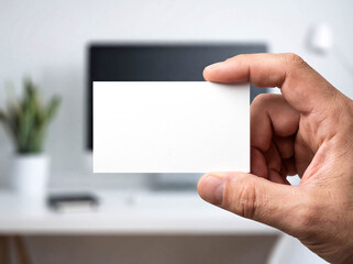 Obraz premium Hand holding blank white business card mockup close up front view centered flat card empty copy space visiting corporate branding identity design presentation template