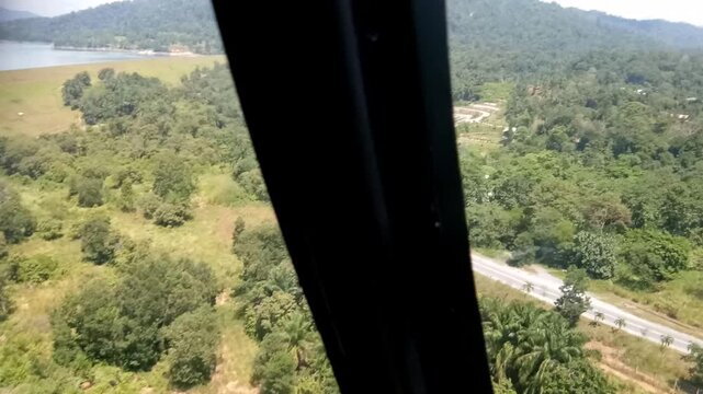 Aerial View of Lush Tropical Rainforest and Green Hills in Kenyir