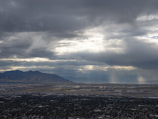 Close view of spectacular sunbeams over airport and Great Salt Lake shoreline