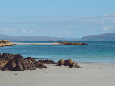 Views over to the Isle of Mull and Ulva across the white sandy beaches of Iona, Scotland