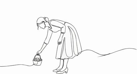 Woman in dress bending down to pick up a small basket.